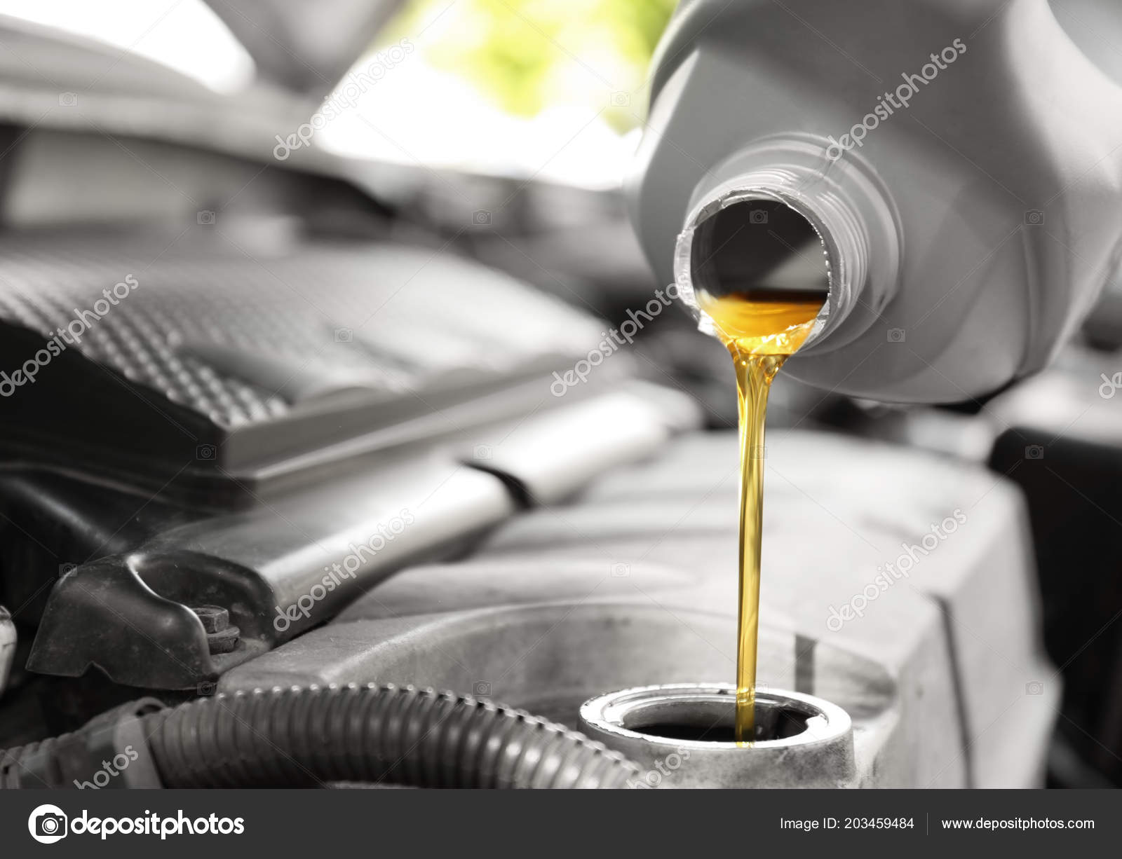 https://st4.depositphotos.com/16122460/20345/i/1600/depositphotos_203459484-stock-photo-pouring-oil-car-engine-closeup.jpg